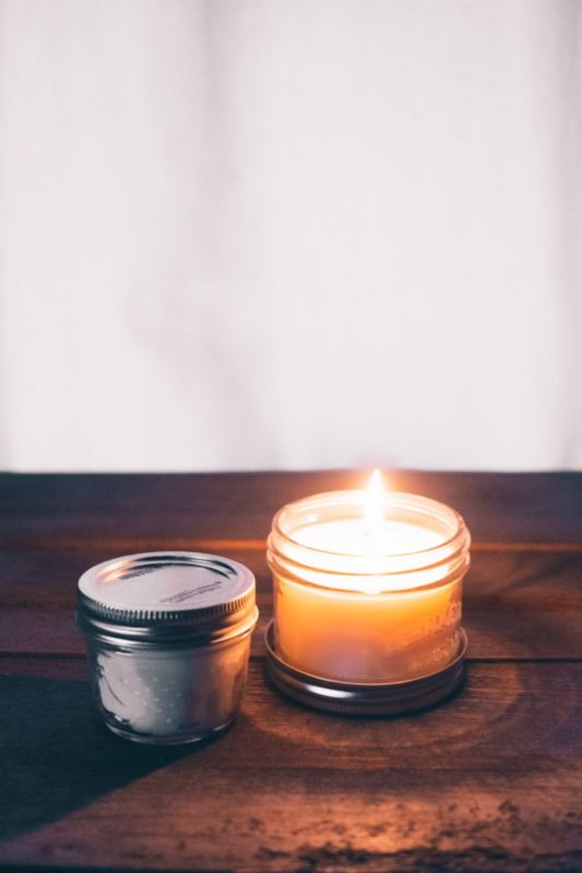 A lit candle on a light background