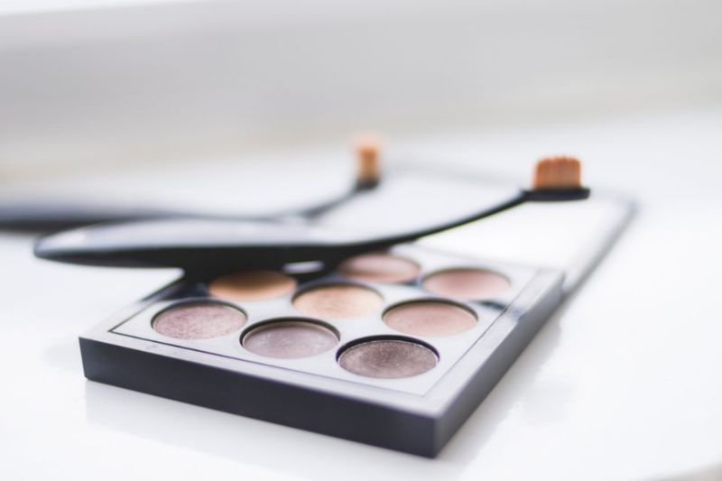 An open eyeshadow palette on a white background