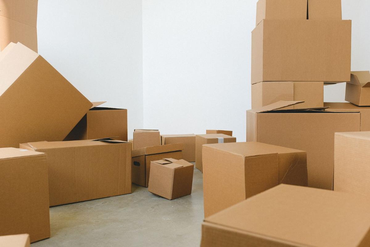 Cardboard boxes spread in a bright room