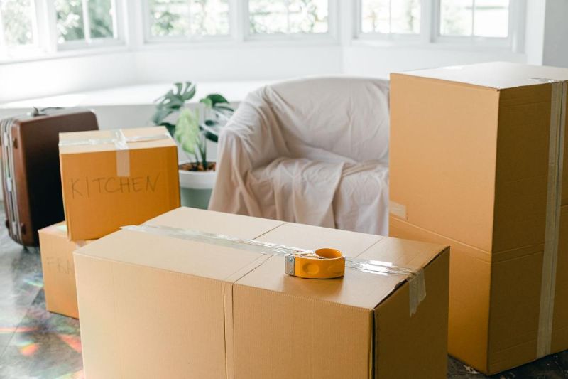 Boxes closed with tape and a kitchen label