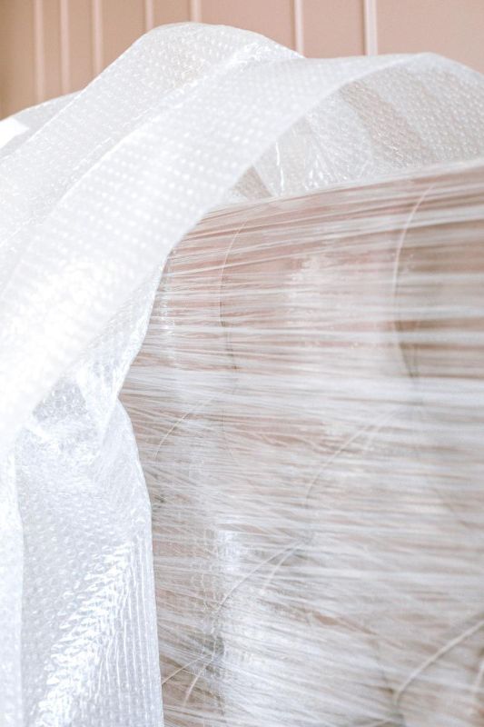 Sofa wrapped in clear film