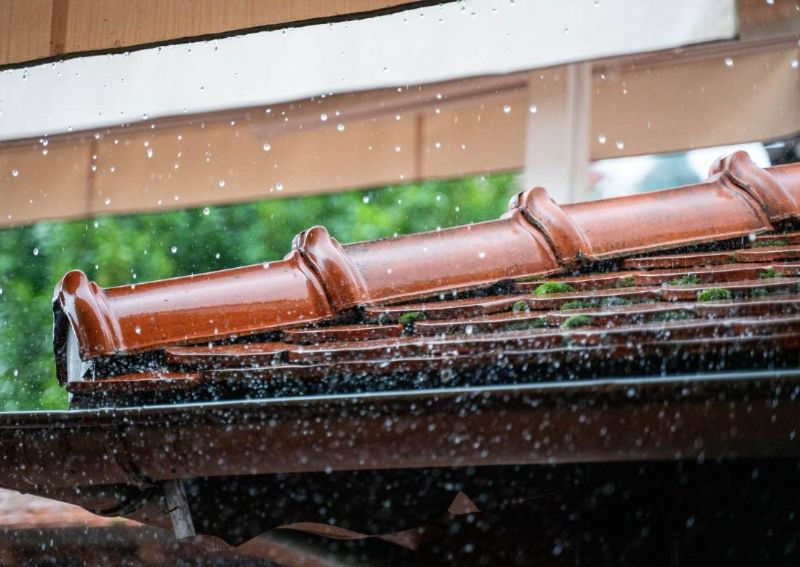Rain on the edge of a tiled roof