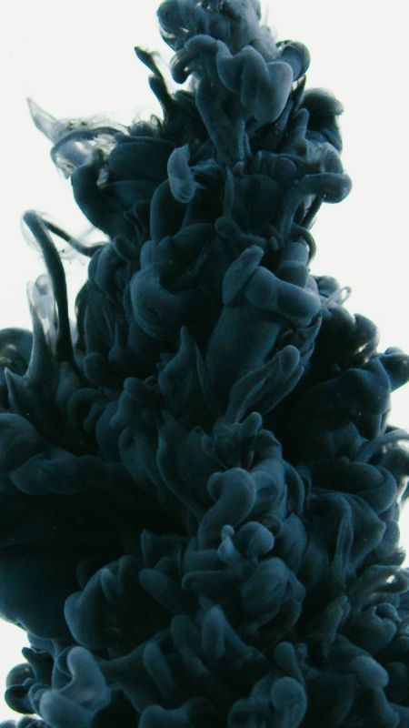 A cloud of black ink dissolving in water